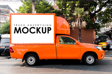 Blank white Sign on a truck for advertising the building on background