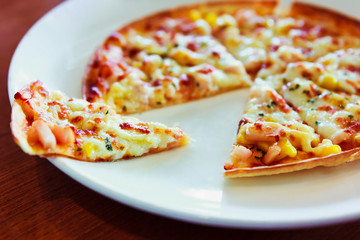 Tortilla Pizza with mozzarella cheese, imitation crab stick, sweet corn and pineapple.