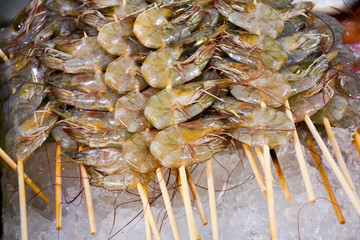 fresh shrimp on skewers in the ice.Asia.Thailand