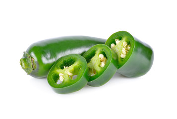 whole and portion cut fresh Jalapeno or Mexican Chili on white background
