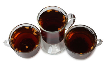 Black tea in a glass cup on a white background
