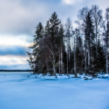 Winter landscape, lake is in the snow