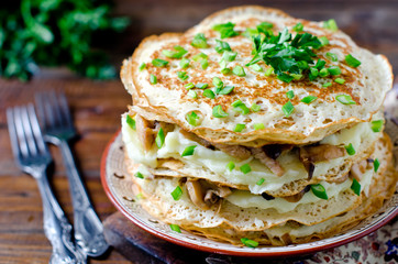 Pancake cake with mushrooms and chicken