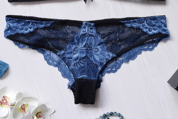 Blue lace lingerie on the white background with fasion women accessories. Sexy woman underwear