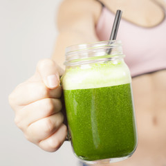 Teenage girl with green smoothie