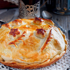 Traditional festive Russian pie - Kournik (pie with chicken and pancakes), square © Анна Журавлева