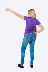 Back view of  pointing woman.