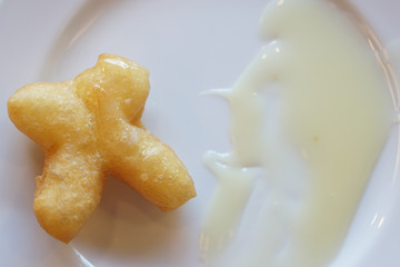 Obraz na płótnie Canvas Deep fried dough-stick.Chinese deep fried dough sticks (famous breakfast in Thailand).