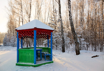 gazebo by the road in a white fairy-tale winter.