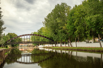 Pedestrian bridge and its reflection, on the Sert&atilde; river, in Sert&atilde;, Portugal - Ponte pedonal e seu reflexo, sobre a ribeira da Sert&atilde;, na Sert&atilde;, em Portugal