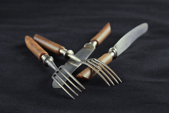 Old forks and knives on the table