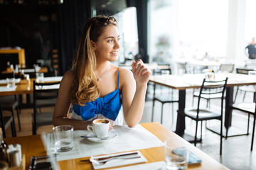 Beautiful woman enjoying her coffee