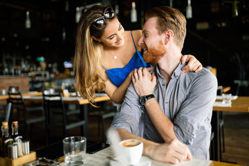 Beautiful man and woman flirt