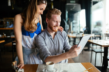 Woman and man flirting in cafe