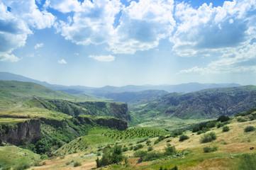 Fototapeta na wymiar Landscape of the mountain plain, green hills and vineyard, Armenia.