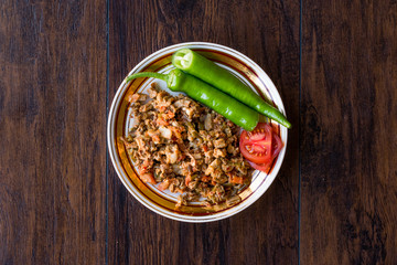 Turkish Street Food Kokorec with Tomato and Green Pepper. (Portion Sheep Bowel)