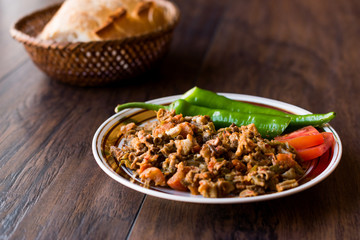 Turkish Street Food Kokorec with Tomato and Green Pepper. (Portion Sheep Bowel)
