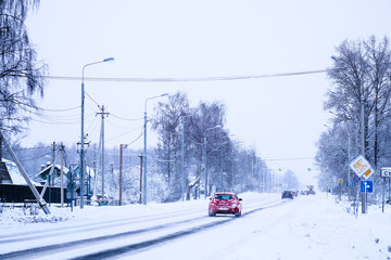 Moscow region, Russia - February, 25, 2018: cars drive down the snow-covered road in Moscow region, Russia