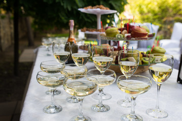 Glasses with champagne and white wine before party in cafe