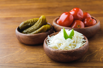 close-up view of delicious pickled vegetables in bowls