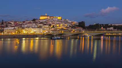 Fototapeta na wymiar Coimbra city and Mondego river at nightfall