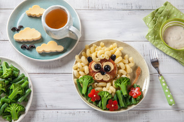 Funny Lion Food Face with Cutlet, Pasta and Vegetables