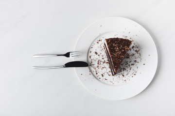 Top view of chocolate cake with glaze on plate