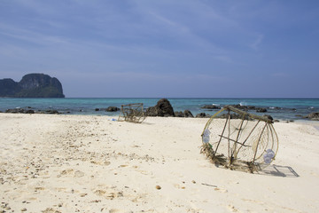 Fishing tackle on the sandy beach (Thailand)