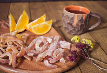 candied tropic fruits on wooden table 