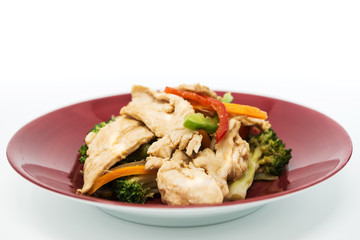 wok fried chicken stir fry with sweet peppers and chinese vegetables