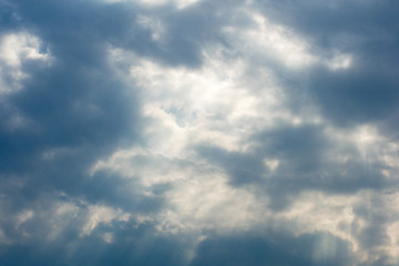 Beautiful cloudscape with large, building clouds and sunrise