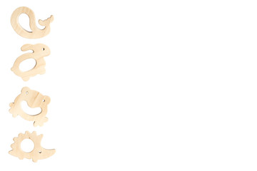 Organic baby teethers isolated on white background with copy space. Wooden animal toys set for babies.