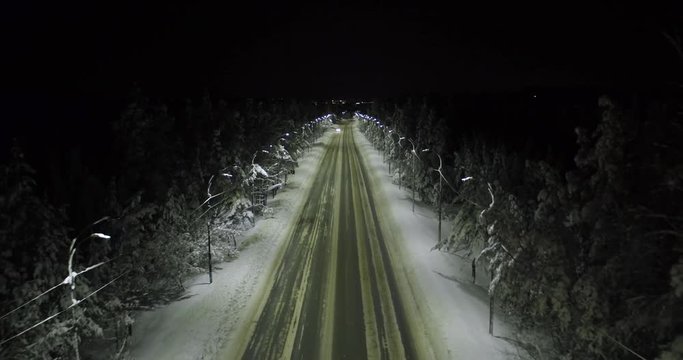 aerial shot night highway with moving cars in winter