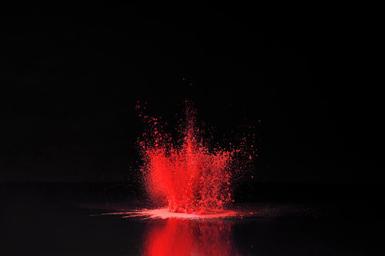 Red Holi Powder Explosion On Black, Traditional Indian Festival Of Colours