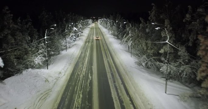 aerial shot night highway with moving cars in winter