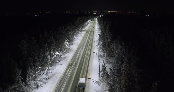 top view cars driving on a winter night highway