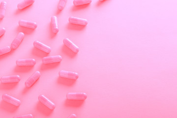 pink pills on pink background top view - 193413920