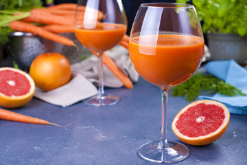 Cutlets from carrots for breakfast. Vegetarian healthy food. Spring vegetables and juices. Grapefruit and basil. Free space for text or a postcard.