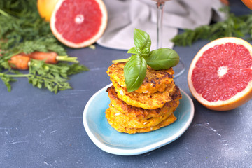 Cutlets from carrots for breakfast. Vegetarian healthy food. Spring vegetables and juices. Grapefruit and basil. Free space for text or a postcard