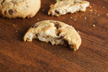 cookies with chocolate on a wooden background