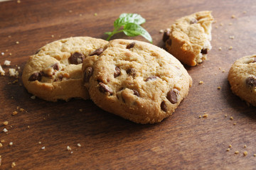 cookies with chocolate on a wooden background