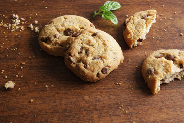 cookies with chocolate on a wooden background