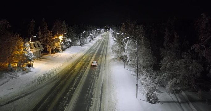 aerial view movement of cars at night highway among forest