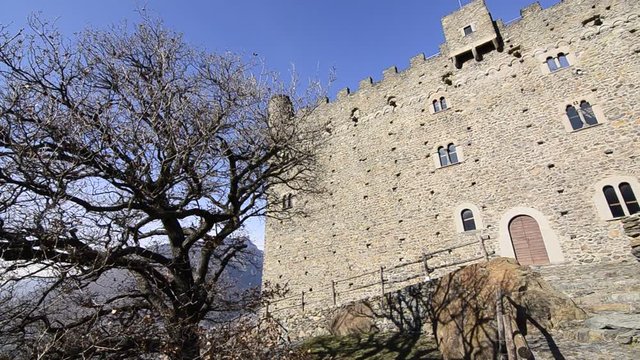 Ussel fraction of Chatillon, Valle d'Aosta, Italy 11 February 2018. Resumption of the facade of the medieval castle of Ussel. Movement of the chamber from left to right