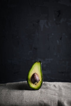 avocado dark background moody healthy food