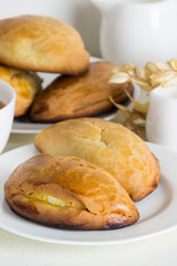 Homemade pies  with cottage cheese and  tea.