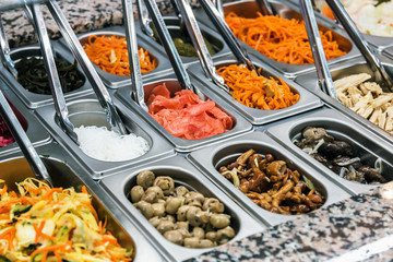 Pickled vegetables on self service restaurant counter or shop counter