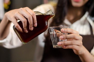 Brew the coffee in a bottle with cup glass