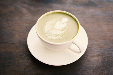 Green tea cup in cafe shop time to relaxing ,hipster tone and soft of focus