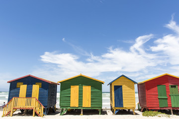 Fototapeta na wymiar Colorful huts/ houses along the beach in Muizenberg, South Africa